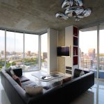 astonishing contemporary architecture for interior with amazing silvery futuristic pendant lamp also gorgeous leather l-shaped sofa and magnificent large glass windows