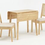 softwood double drop leaf table with a pair of simple dining chairs