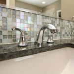 dark grey and white groutless tiles for backsplash area a square white vessel sink and stainless steel faucet