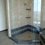 mosaic tiles shower floor system with  black tiles decoration brown marble shower wall a frameless glass door shower space brown ceramic tiles flooring for bathroom