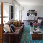 winning small living room idea with interesting brown leather sofa and alluring blue rug with elegant twin arch lamps with concrete flooring