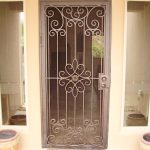 screen door with security panel made from crafted metal