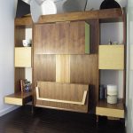 stunning natural wooden fold up wall bed design with standing storage idea beneath white wall upon dark laminated flooring