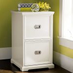 white modern wood file cabinet ikea wth two double drawers and books and flower vase plus glass ornament on top for home office interior