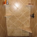 Brown ceramic tiles for shower space with some floating corner shelves
