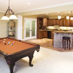 Lower level game room and bar in residential home.