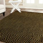 smart patterned black jute rug design with yellow pattern on washed white flooring with white furniture of modern table and sofa