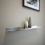 metal picture ledge shelf with artworks and ceramics for space saving room