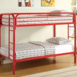 red metal bunk bed for small space design with white bedding aside potted plants on wooden floor with glass window