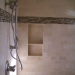 Larger built in shelf idea for shower space with full and permanent panel a heldhand showerhead
