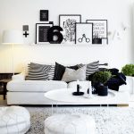 White And Black Theme Living Room With Wall Accessories White Sofa Stripes Pillows Standing Lamp Table And Fur RUg