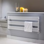 luxurious modern bathroom idea with gray siding and stacked on the wall white metal target towel with candelabrum and vanity