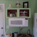 White Small Space Saver Microwave In Green Wall Kitchen