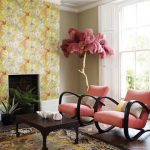 amazing interior design with yellow double wallpaper and coral colored chairs with black wodoen frame and patterned area rug and glass window