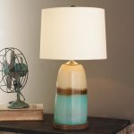 cute turquoise and cream 3 way table lamps with unique pudding lamp post and white shades decorated on wooden table and table fan