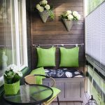 gorgeous apartment balcony furniture with small wooden bench and decorative cushion plus siimple outdoor chairs and round glass top coffee table and cute flowers