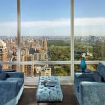 wondrous blue velvet couch idea with light blue coffee table and wooden floor and open plan with city view in luxurious apartment