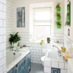 gorgeous white and blue bathroom color trend with green succulent planters and white brick wall and tile vanity