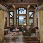 lovable interior design of wooden house with wodoen floor and log decoration and glass window and comfortable seating