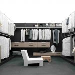 luxurious closet design idea with black and white color combination with beige dresser and white small chair