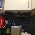 magnetic-strip-for-knives-mounted-on-the-cabinet-under-the-cabinet-in-the-corner-of-the-kitchen-room-near-kitchen-stuffs