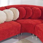 red microfiber sectional set with white and red round accent pillows