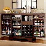 stylish convertible wine rack idea made of wooden material with glass storage beneath black framed bar glass window