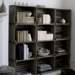Arrangement of unused wine crates as bookcase idea