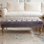 Grey tufted leather Ottoman coffee table with antique wood legs