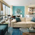 Modern Teal Living Room Decor On Wall Chair Floor And Pillows With Glass Round Table