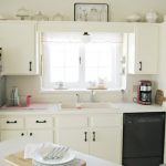 White bulb lamp over kitchen sink white kitchen cabinet system