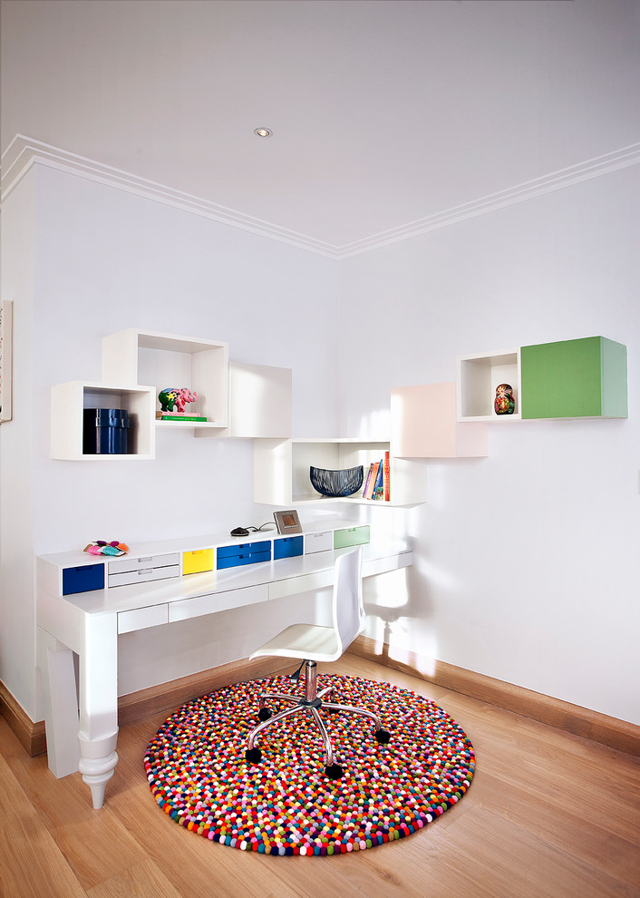 modern working space bespoke shelves idea white freestanding working desk with bright colored drawers movable working chair in white multicolored area rug in round shape medium toned wood floors