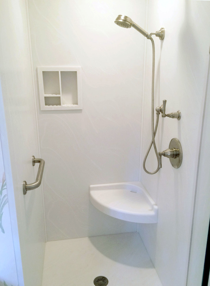 small walk in shower with corner floating shelf recessed shelves and stainles steel shower appliances