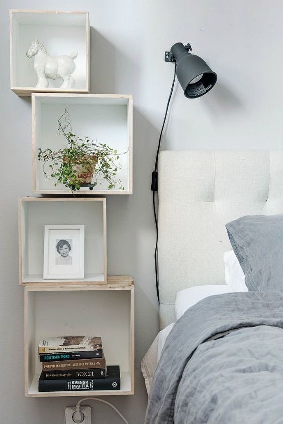 creative DIY nightstand consisting of piled shelves