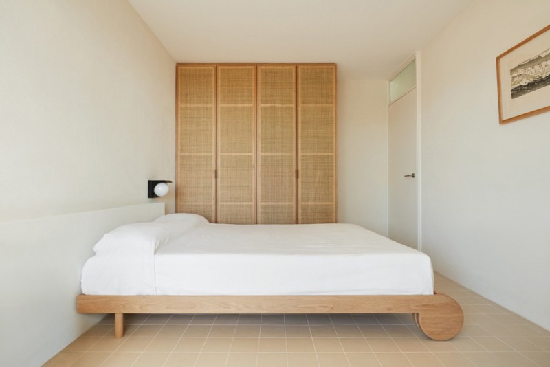 simple and minimalist bedroom design light wood bed frame white bedding treatment light wood closet white walls light cream tile floors
