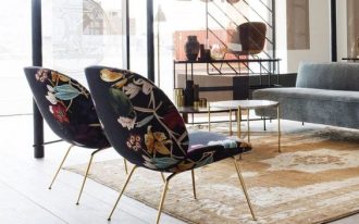 Beetle lounge chair with colored floral patterns and gold finish legs