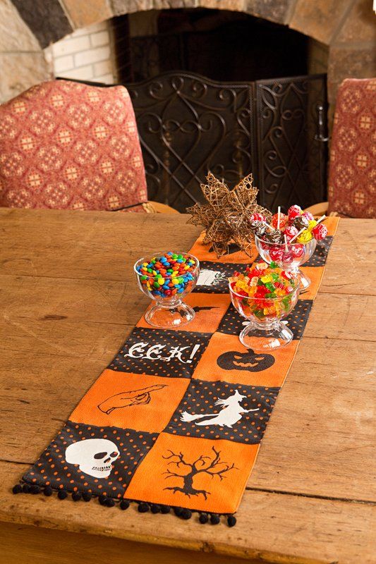 smaller Halloween table runner in orange and black with Halloween prints