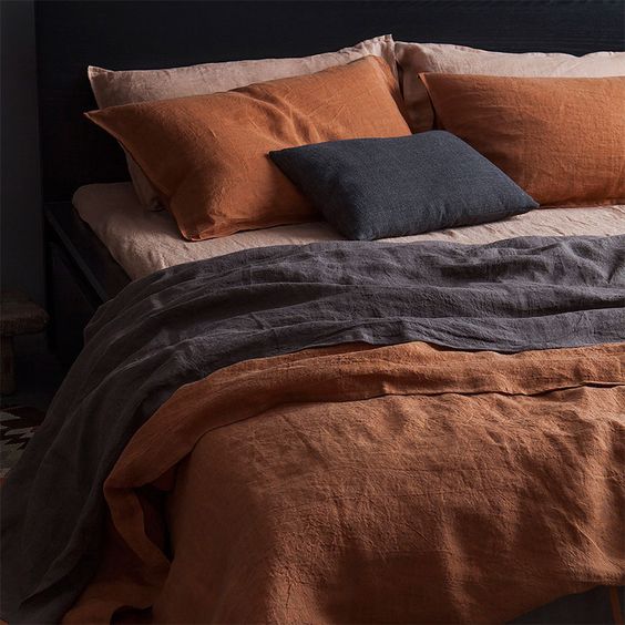 perfect combination of bold blue blush pink and terracotta for bedding treatment