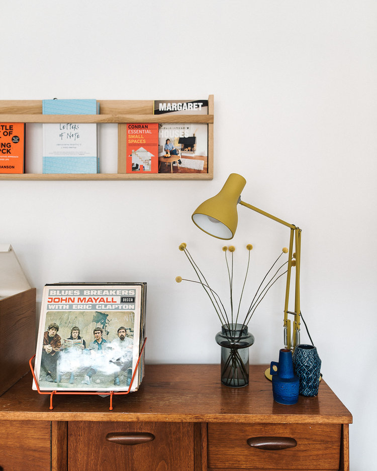 orange magazine stand black glass pot for greenery yellow table lamp wall mounted wood book shelf
