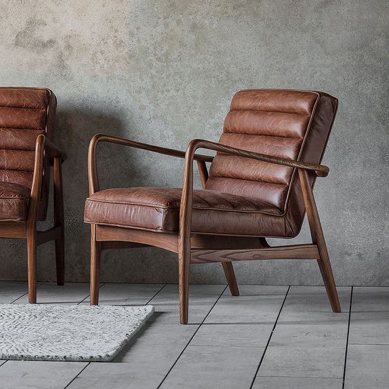 retro armchair with brown leather upholstery and solid ash wood frame