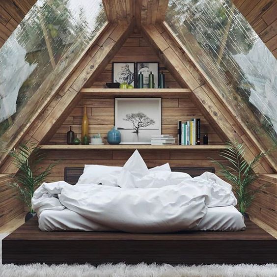 attic bedroom idea with clear glass panels recessed book shelves platform bed crisp white bed linen crisp white duvet cover white shag rug