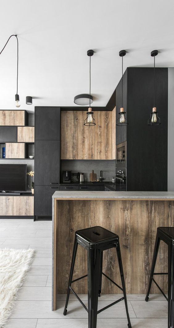 black kitchen cabinets with worn out wood panel accents mini bar with worn out wood base black plastic stools in modern style