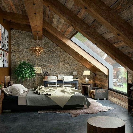 rustic bedroom with unique glass window bed furniture stoned wall hardwood ceilings working desk and chair