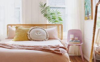 soft toned and minimalist bedroom light wood bed frame with headboard light purple chair white draperies white area rug