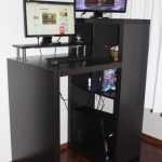 tiny black dek stand for office two sets of flat-screen computers