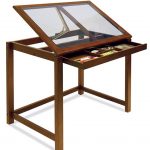 drafting stand-table with glass top panel and wide under drawer as the storage