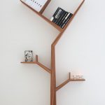simple tree-shaped bookcase with some book collections