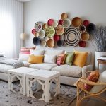 white painted wall white sofa wooden armchair white moroccan accent coffe table beautiful and colorful wall decor colorful cushions stunning moroccan living room