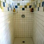 adorable color tile backsplash combined with white tile wall and floor in narrow bathroom with walk in showers designs