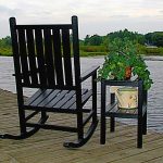 amazing black lawn chair design with tall deck backrest and armrest with rocking mode aside black wooden deck table with greenery aside lake upon wooden deck